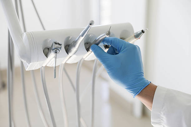 Professional Tooth Extraction technician working in Johnston, IA